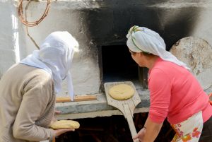 Summer 2014 ...baking traditional bread. From the cultural activities of "Two arch type houses in Archangelos Rhodes - Ambassadors of Hellenic Culture.